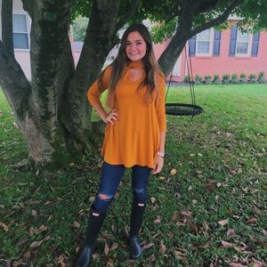 Keyhole mustard shirt.